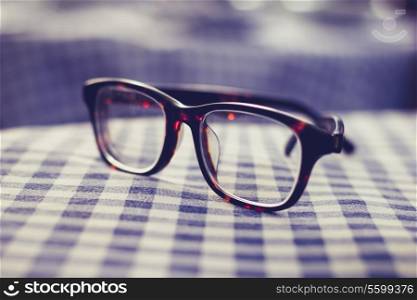Glasses on checkered cloth