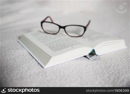 glasses opened book. High resolution photo. glasses opened book. High quality photo
