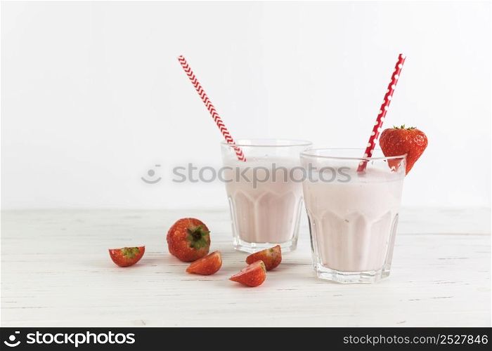 glasses strawberry milkshake table