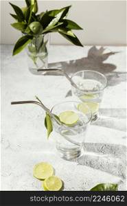 glasses water with lemon slices table