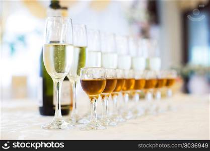 glasses with Champagne on white table