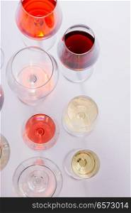 Glasses with red, white and rose wine, top view scene. Set of glasses with wine