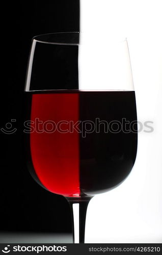 Glasses with wine on the color background