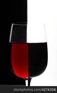 Glasses with wine on the color background