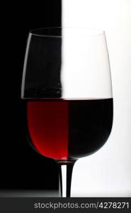 Glasses with wine on the color background