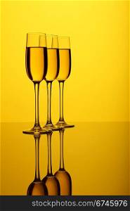Glasses with wine on the color background