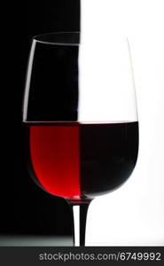 Glasses with wine on the color background