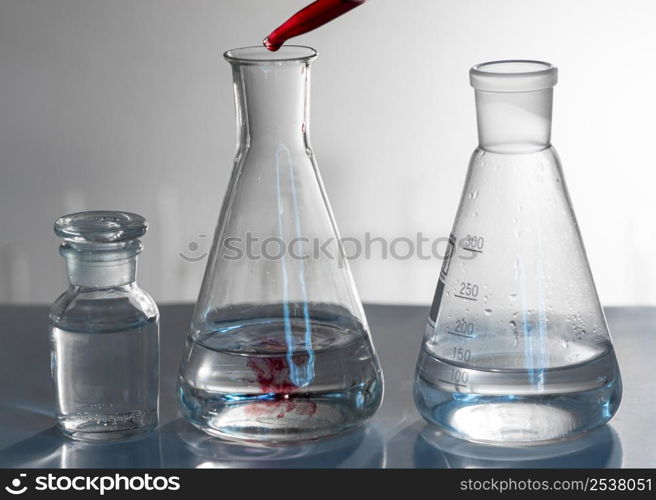 glassware arrangement with red substance