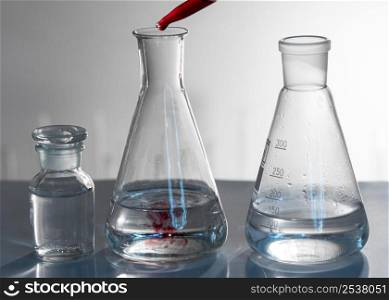 glassware arrangement with red substance
