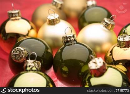Glassy christmas baubles on red background