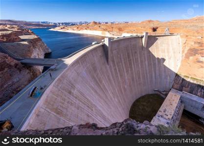 Glen Canyon Dam with Lake Powell in the Desert rural area of Page city Arizona, United States. USA Landmark environmental water resources reservoir and electricity concept.