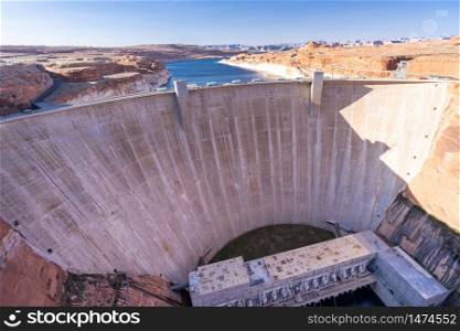 Glen Canyon Dam with Lake Powell in the Desert rural area of Page city Arizona, United States. USA Landmark environmental water resources reservoir and electricity concept.