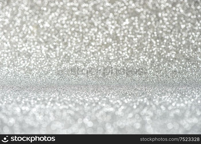 Glitter and lights. Shiny festive silver background