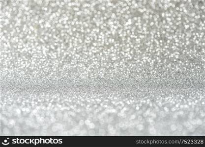Glitter and lights. Shiny festive silver background