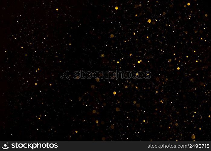 Glitter particles shiny star dust fall on black background