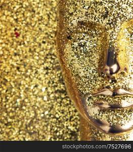 Glittering, golden head of a mannequin sculpture