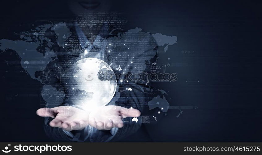 Global business. Close up of businesswoman holding digital globe in her hands