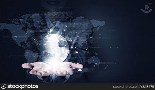 Global business. Close up of businesswoman holding digital globe in her hands