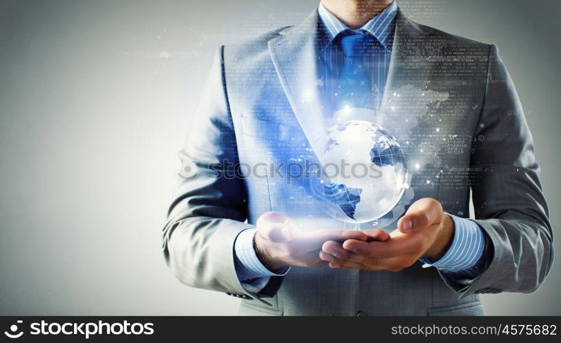 Global business technologies. Close up of businessman holding digital globe in palm