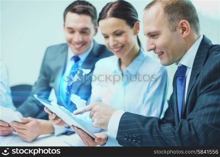 global business, technology and people concept - smiling business team with tablet pc computer and virtual globe projection having discussion in office
