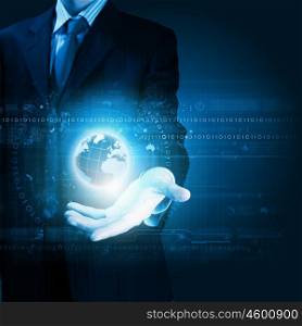 Global computing. Close up of businessman holding digital globe in palm