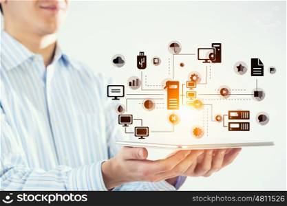 Global connection. Hand of businessman holding touchpad pc presenting social network concept