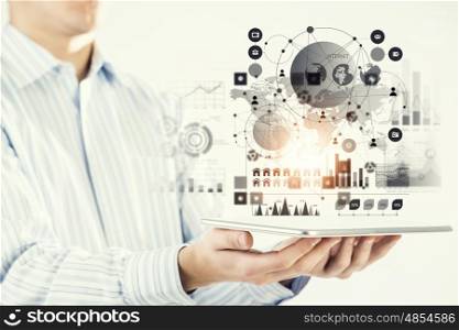 Global connection. Hand of businessman holding touchpad pc presenting social network concept