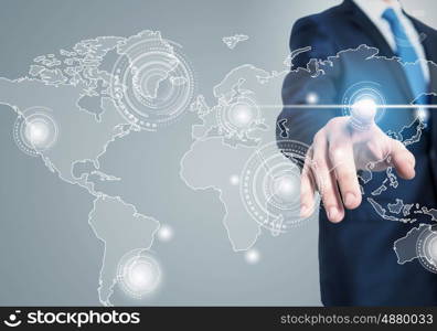 Global interaction. Close up of businessman touching digital screen with finger