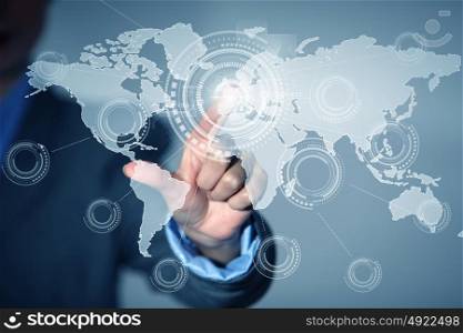Global interaction. Close up of businessman touching digital screen with finger