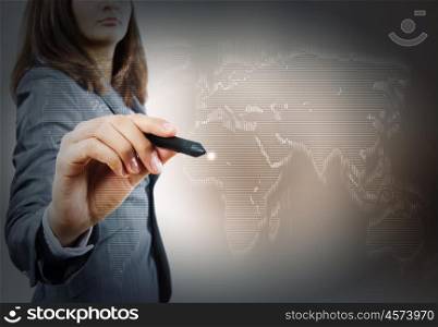 Global interaction. Close up of businesswoman drawing world map with pen