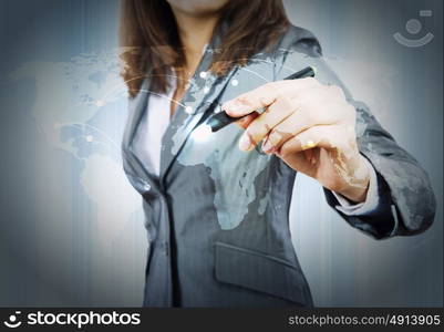 Global interaction. Close up of businesswoman drawing world map with pen