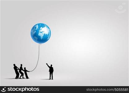 Global interaction. Silhouettes of people pulling Earth plane with rope