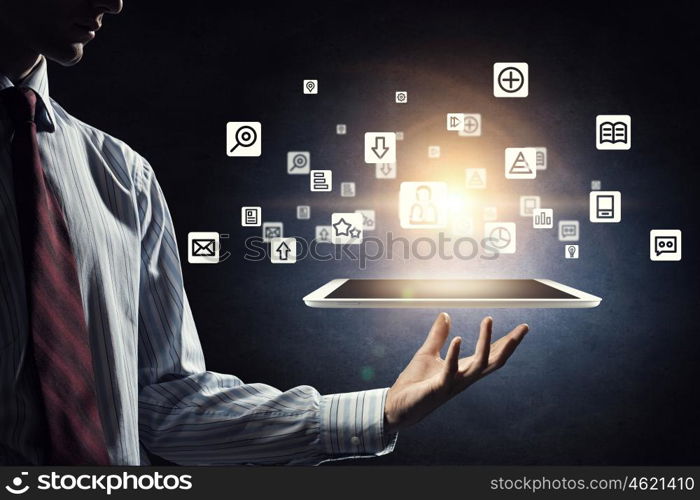 Global network connection. Hand of businessman holding touchpad pc presenting social network concept