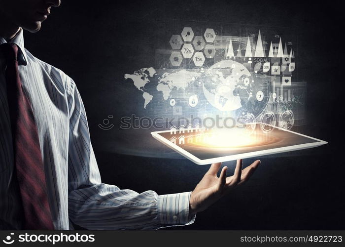 Global network connection. Hand of businessman holding touchpad pc presenting social network concept