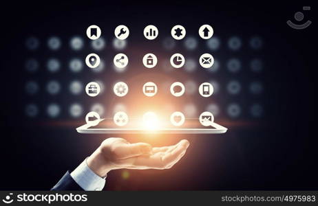 Global network connection. Hand of businessman holding touchpad pc presenting social network concept