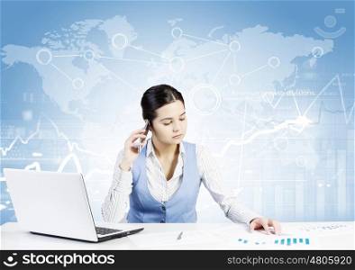 Global network interaction. Beautiful young lady at desk talking on mobile phone with social network concept at background