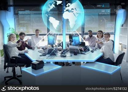global network, technology and people concept - business team with tablet pc and computers showing thumbs up at office. happy business team with earth hologram at office