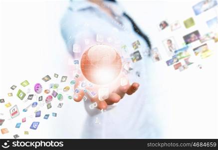 Global technologies. Image of globe on palm of businesswoman. Media technologies