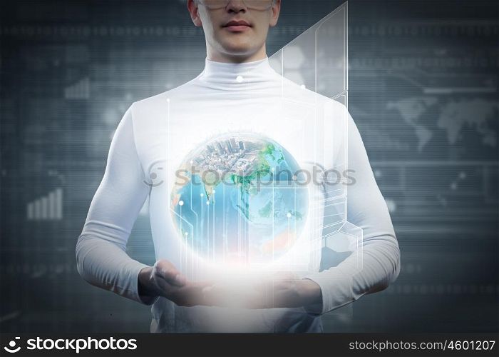 Global technologies. Man holding globe in hands. Futuristic concept. Elements of this image are furnished by NASA