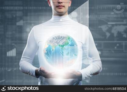 Global technologies. Man holding globe in hands. Futuristic concept. Elements of this image are furnished by NASA