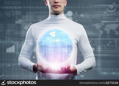 Global technologies. Man holding globe in hands. Futuristic concept