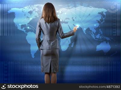 Global technologies. Rear view of businesswoman pointing on media screen