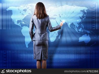 Global technologies. Rear view of businesswoman touching media screen