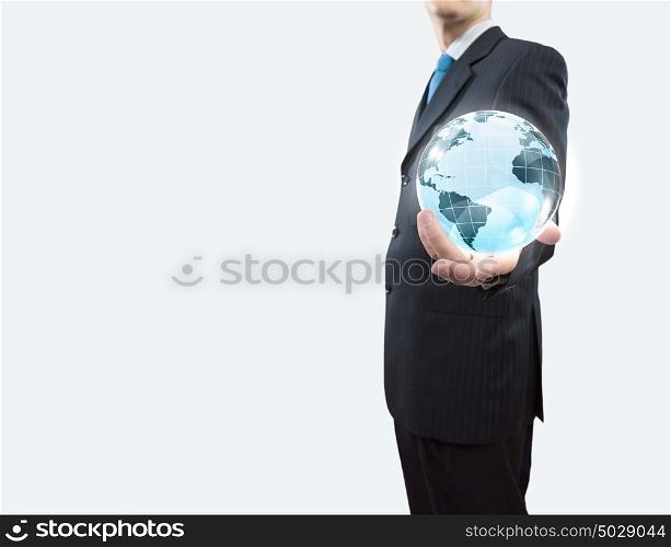 Global technologies. Young businessman holding Earth planet in palm