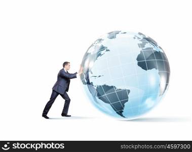Global technologies. Young successful businessman pushing Earth planet ball