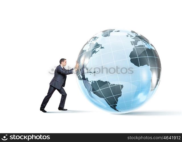 Global technologies. Young successful businessman pushing Earth planet ball