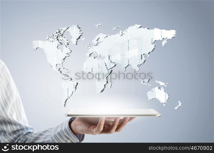 Global technology concept. Businessman hands holding tablet with world map on screen