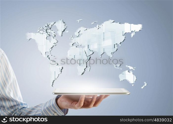 Global technology concept. Businessman hands holding tablet with world map on screen