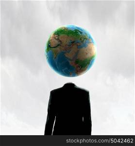 Global thinking. Business man with globe for head. Elements of this image are furnished by NASA