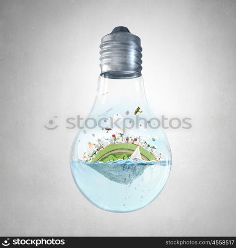 Global warming concept. Glass light bulb with water and cityscape inside